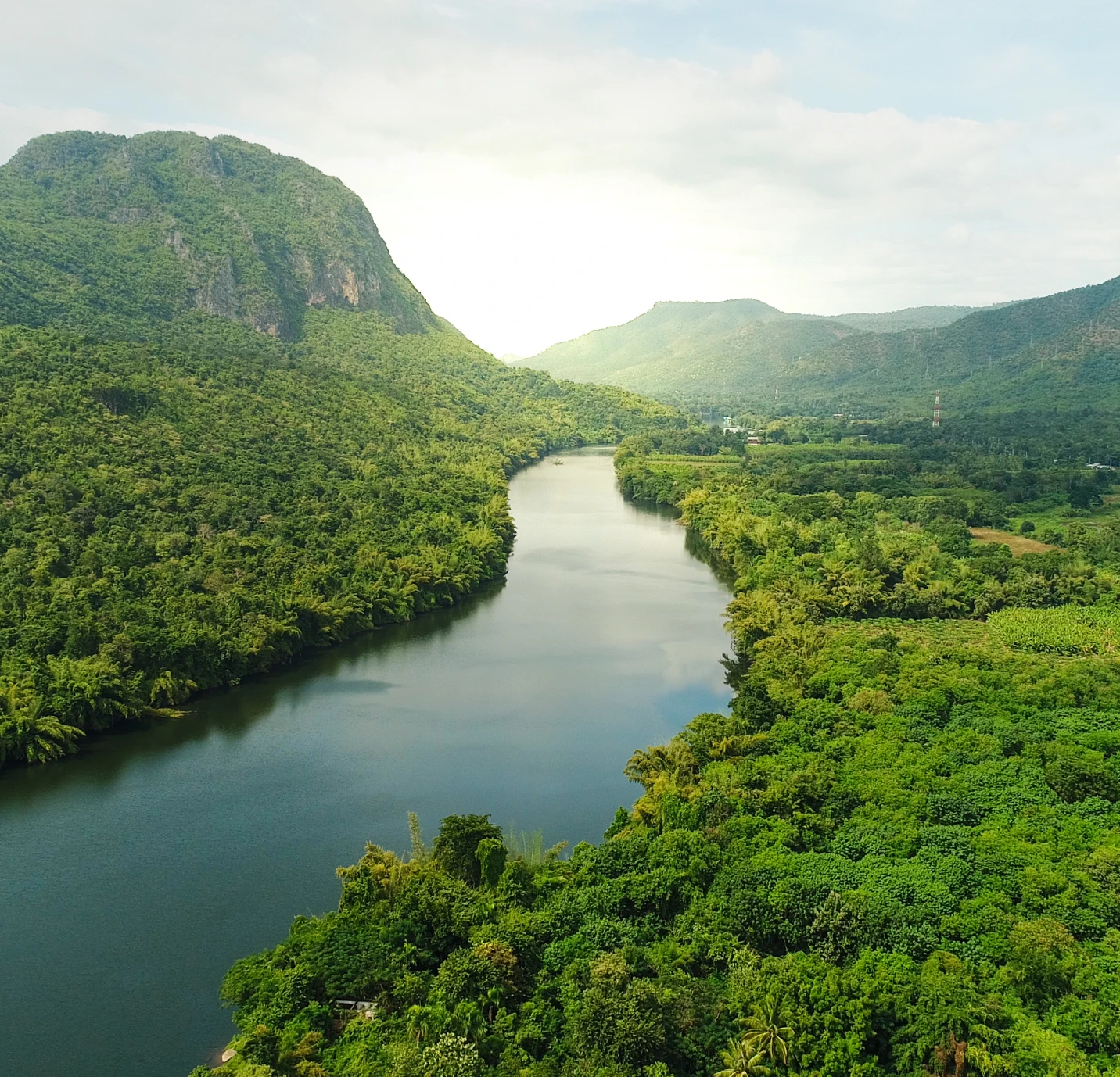 Lush river landscape with green mountains